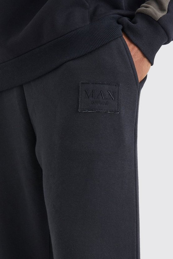 Jogginghose mit geteiltem Saum und zerrissenem Aufnäher
