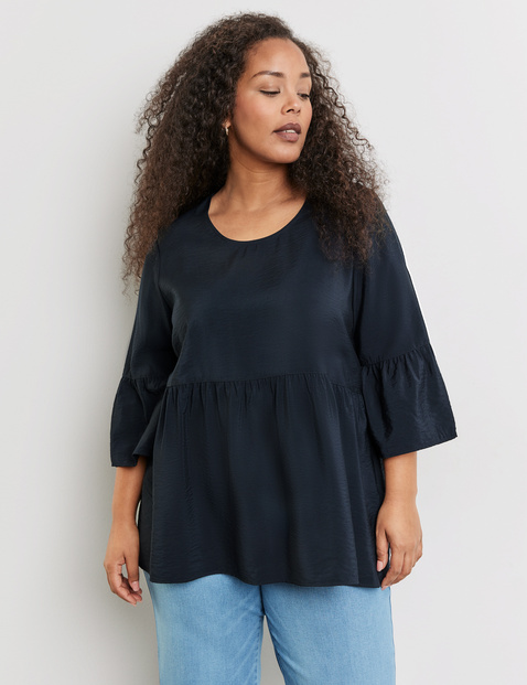 Ausgestellte Bluse mit Volants