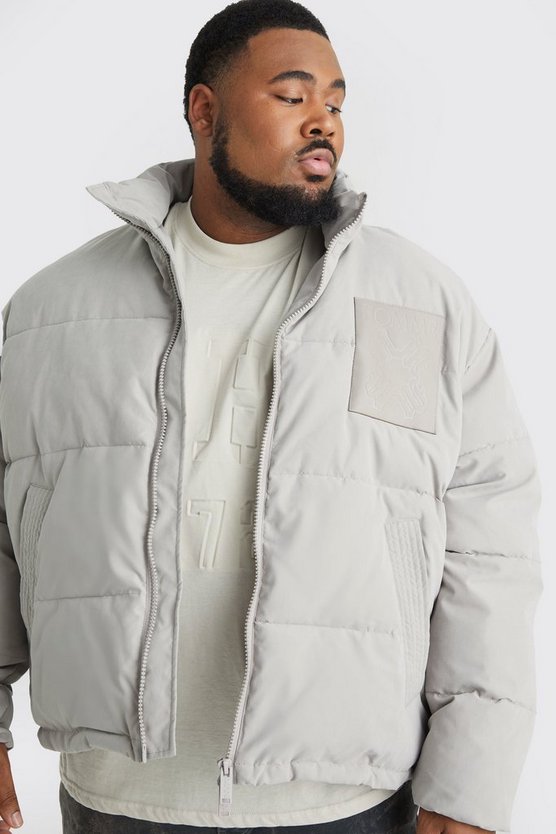 Plus kastige Oversize Nylon-Steppjacke mit PU-Aufnäher