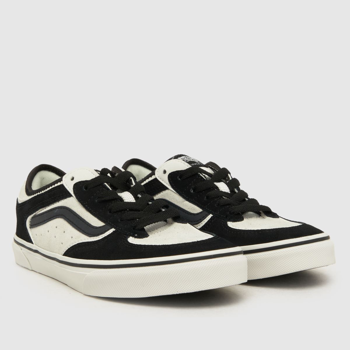 Vans vita och svarta Rowley klassiska ungdomsskor