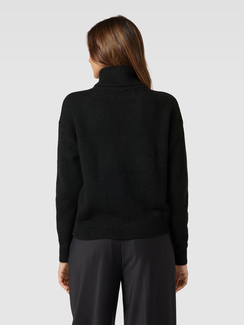 Rollkragenpullover mit überschnittenen Schultern in schwarz