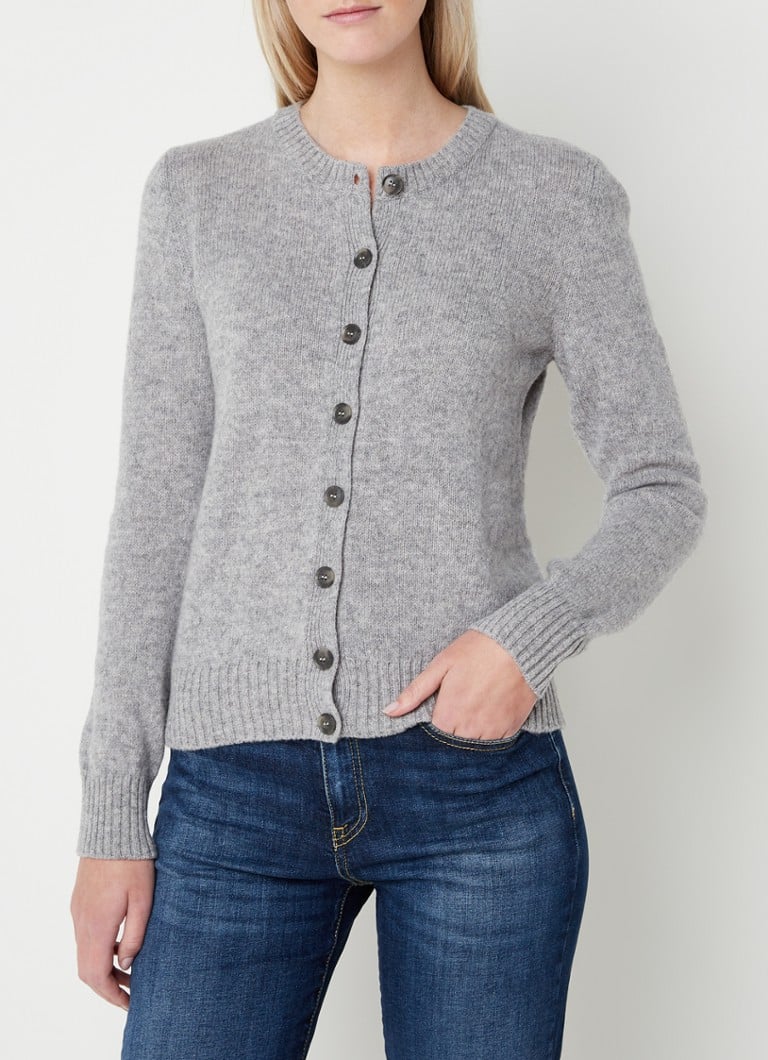 Cardigan Benetton cu guler rotund, confecționat din lână fină.