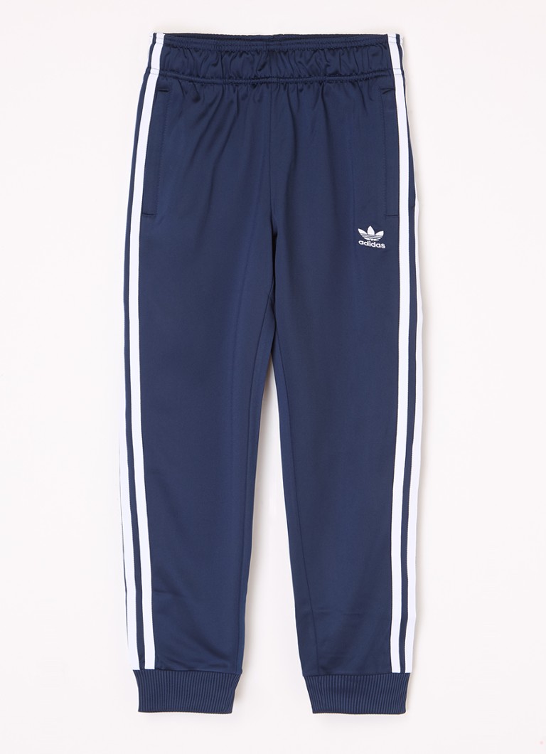 Teplákové kalhoty Adidas zúženého střihu s výšivkou loga