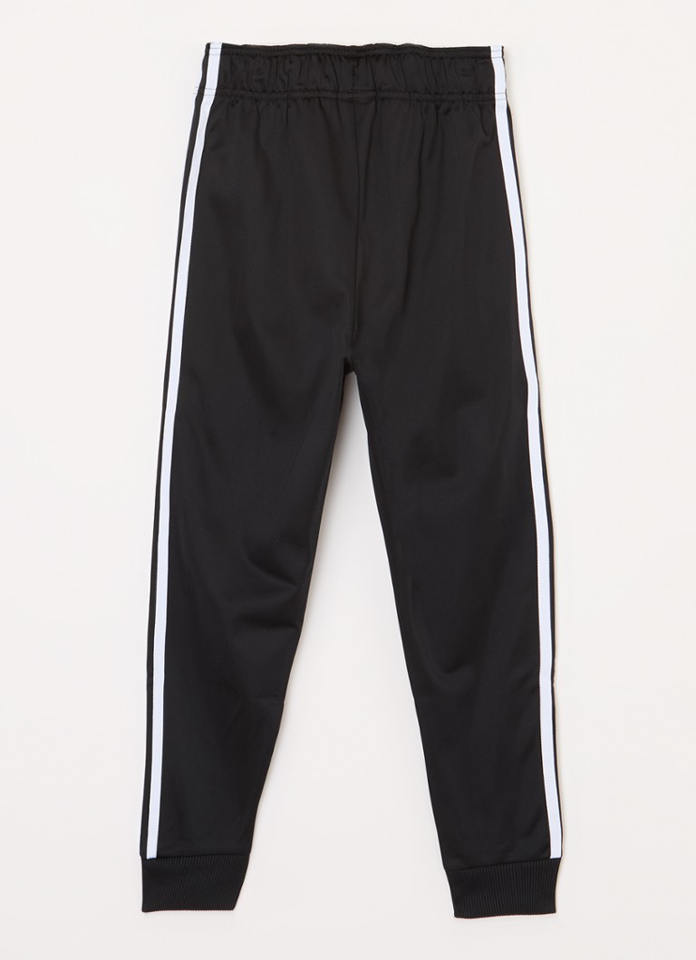 Teplákové kalhoty Adidas zúženého střihu s výšivkou loga