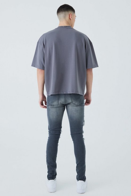 Super Skinny Bikerjeans mit Rissen und Farbspritzern