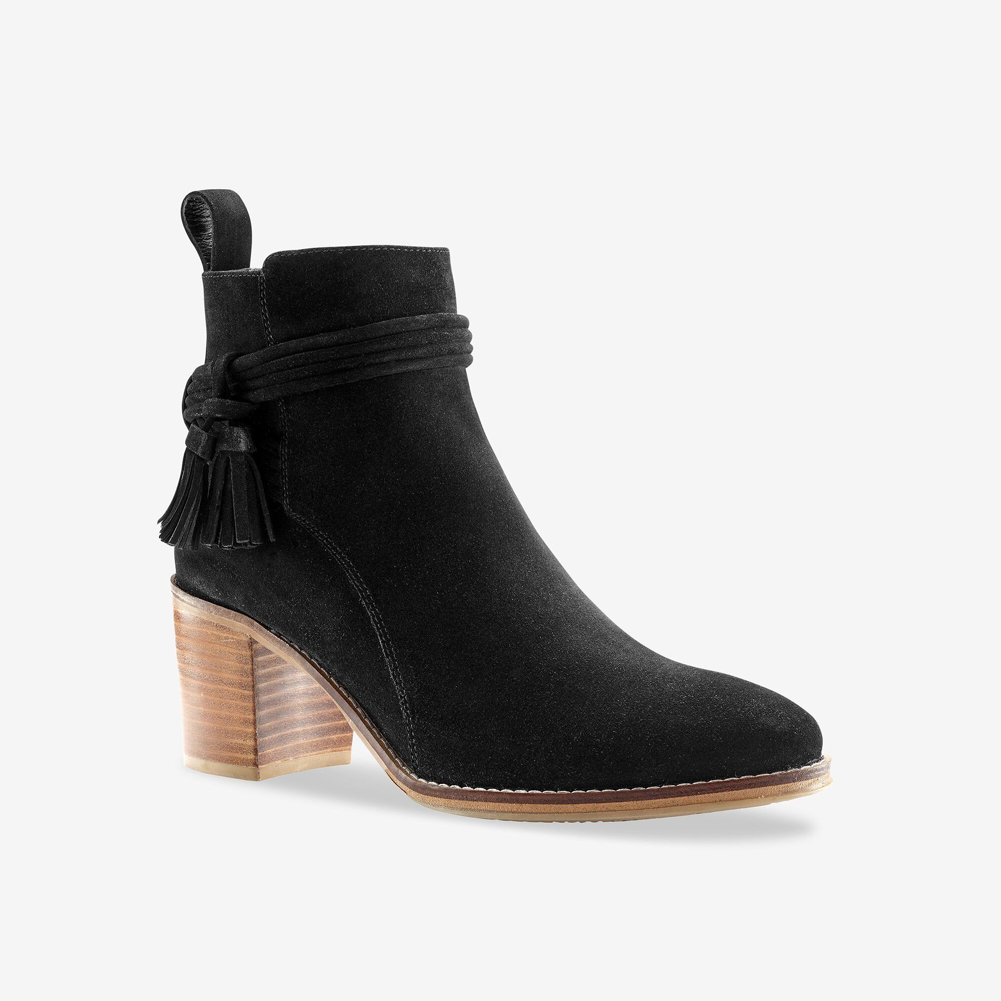 Boots en croûte de cuir à talon et pompons