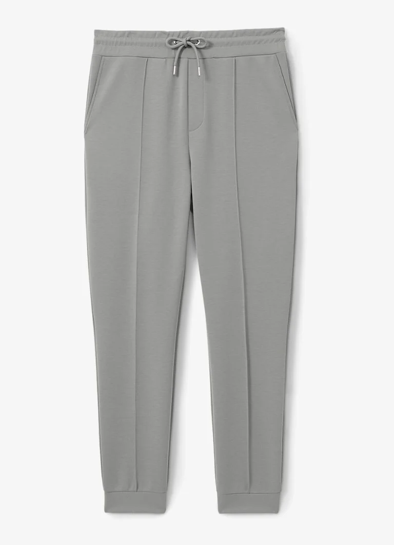 Pantaloni de trening conici Reiss Premier cu buzunare cusute.