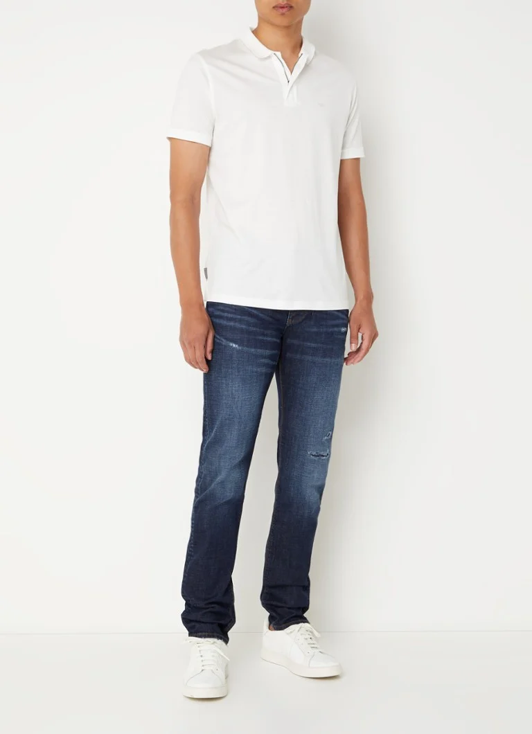 Calça jeans slim fit da Emporio Armani com acabamento destroyed.