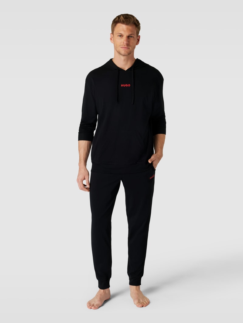 Sweatpants in unifarbenem Design mit elastischem Bund in schwarz