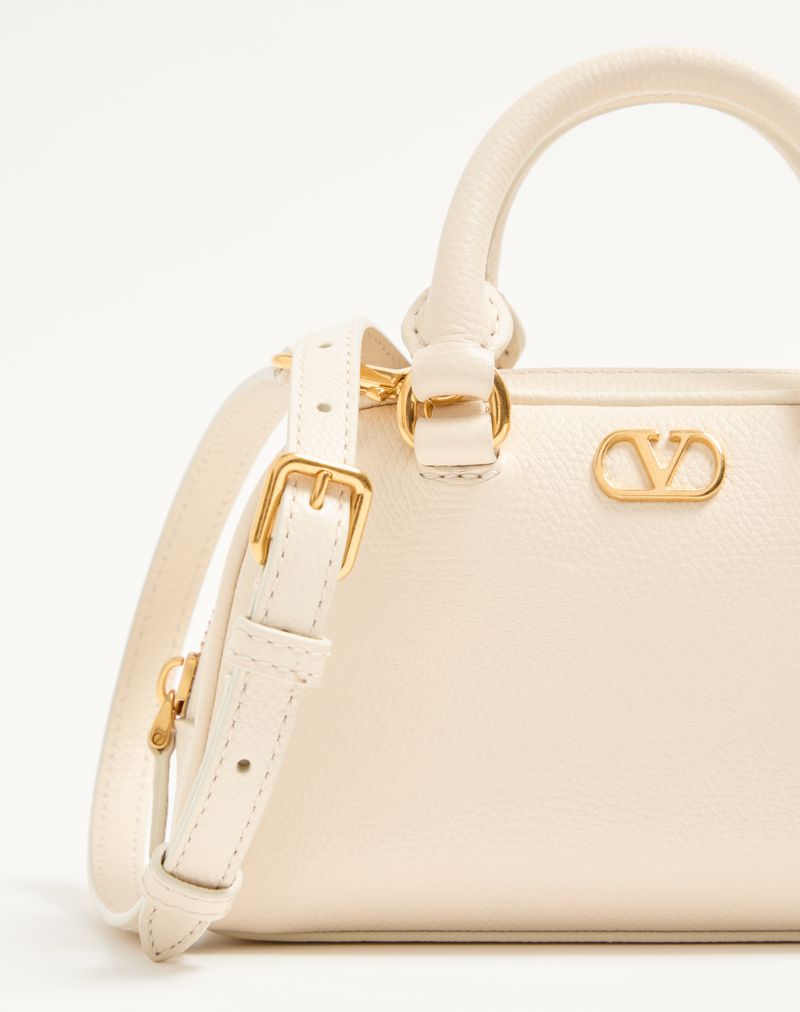 Bolsa tipo mochila Mini VLogo Signature em couro de bezerro granulado