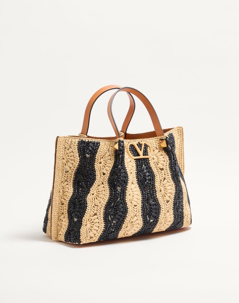 Bolsa de compras média Valentino Garavani em ráfia com estampa ondulada.