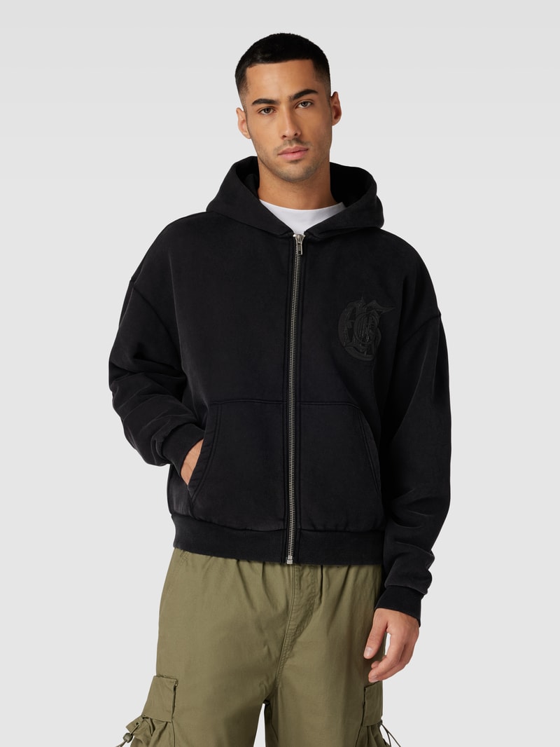Sweatjacke mit überschnittenen Schultern in schwarz