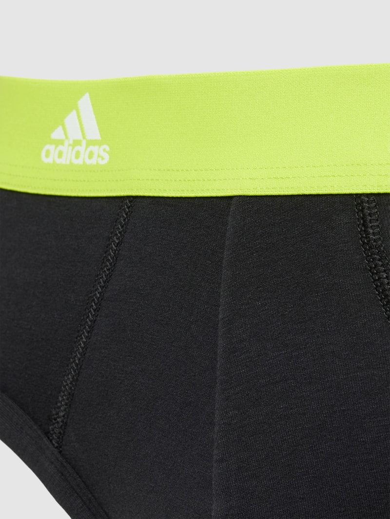 Slip mit Allover-Logo-Muster in neon gelb