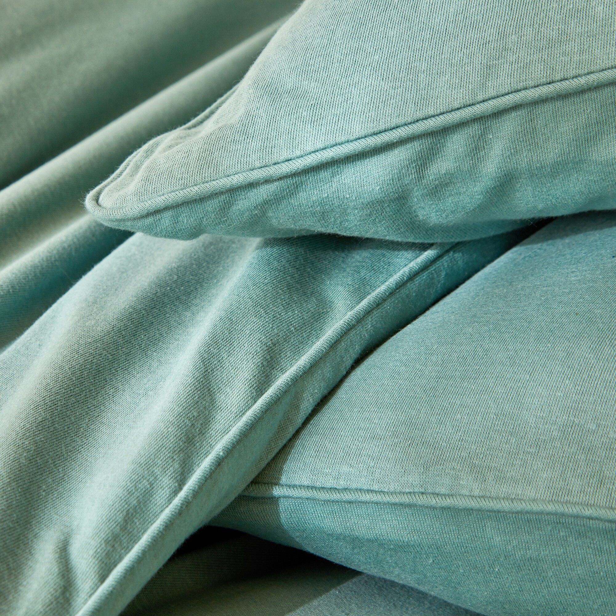 Linge de lit uni en jersey passepoilé coton