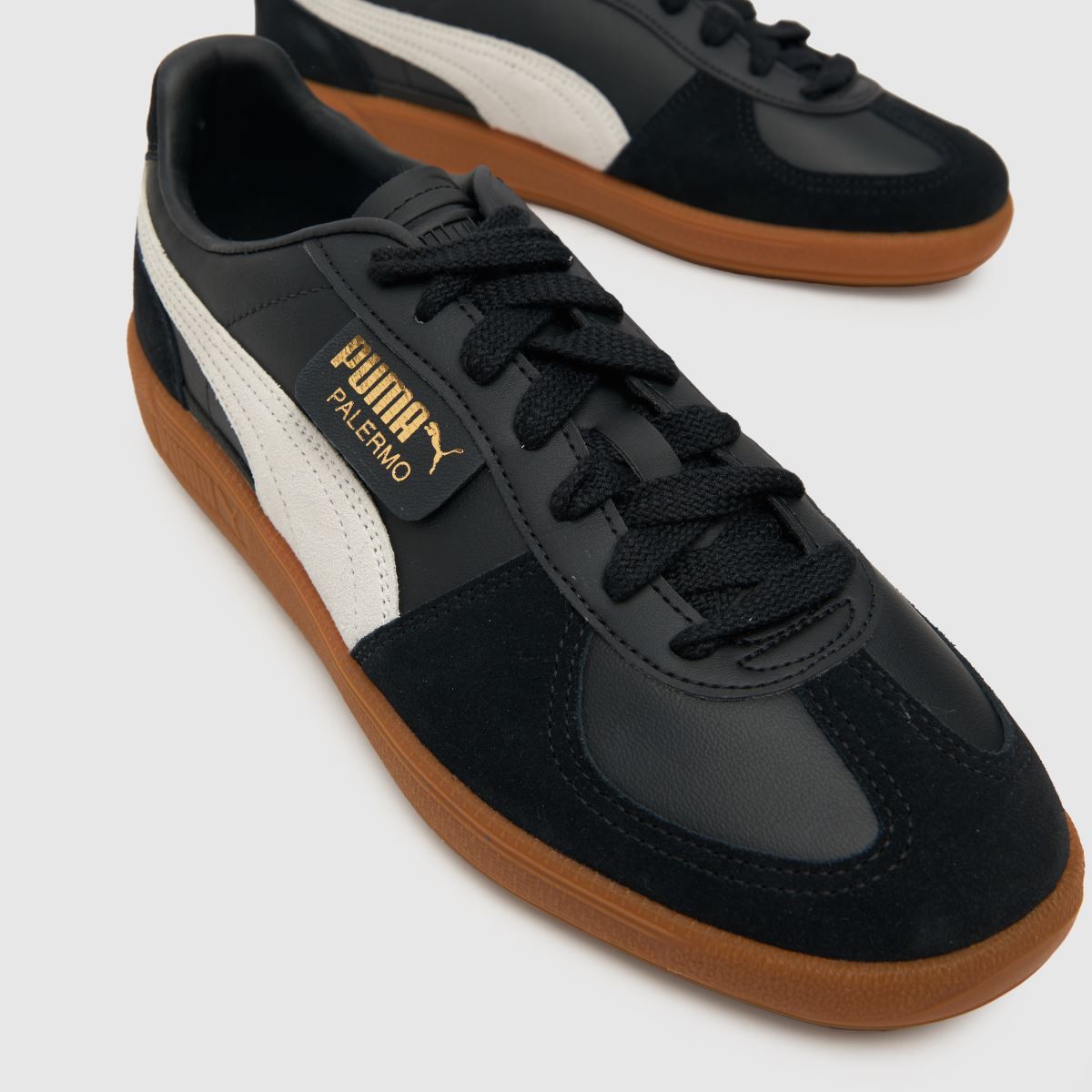 PUMA Palermo lädersneakers i svart och vitt