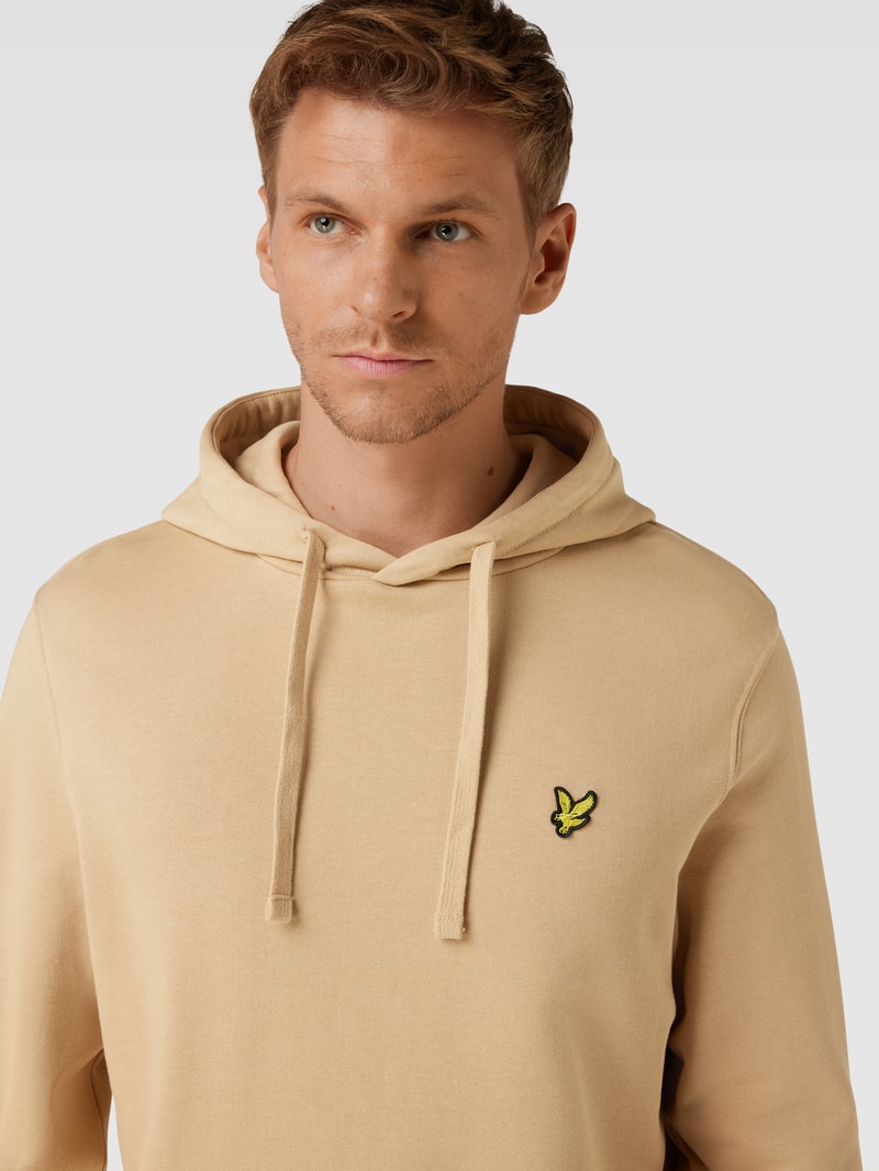 Hoodie mit Motiv-Stitching und Känguru-Tasche in beige