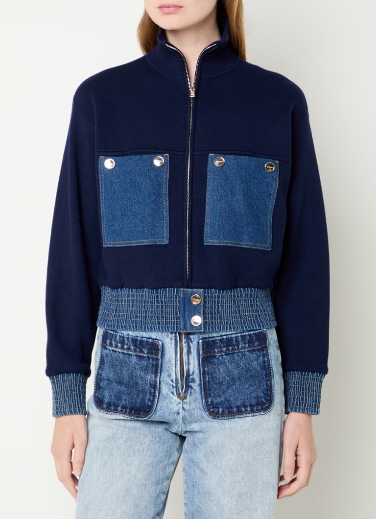 Sandro  Fijngebreid vest met details van denim