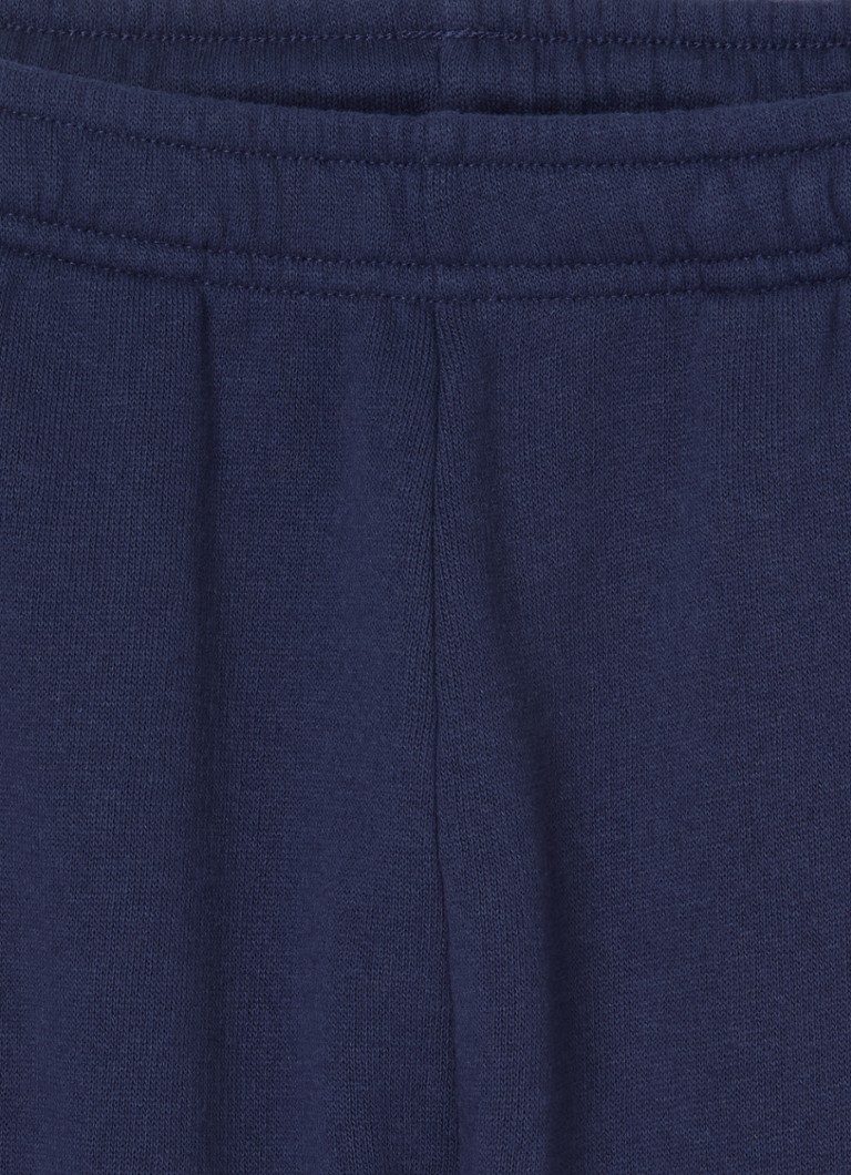 Sporttiset ja rikkaat mailakuvioiset kapenevat collegehousut