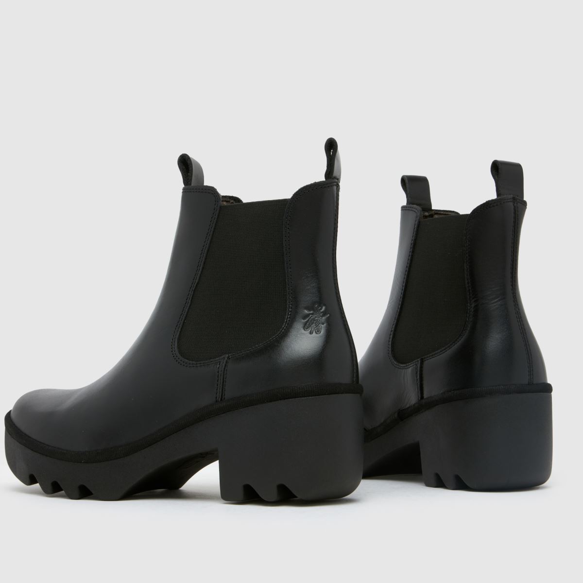 Fly London – Svarta chelseaboots med klack och triangelmönster