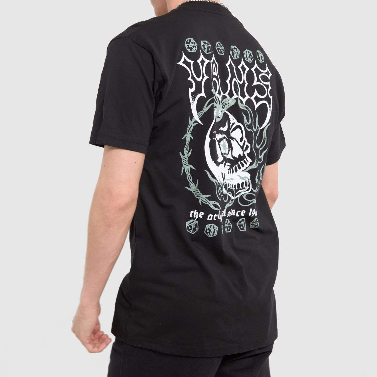 Vans – Svart och vit t-shirt med lucky streak-motiv