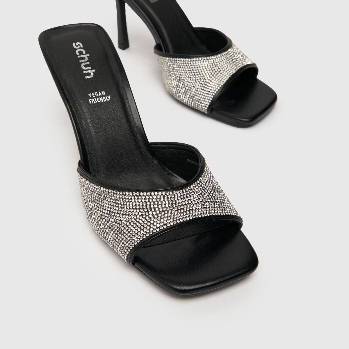 Schuh – Svarta högklackade muleskor med sherryutsmyckning