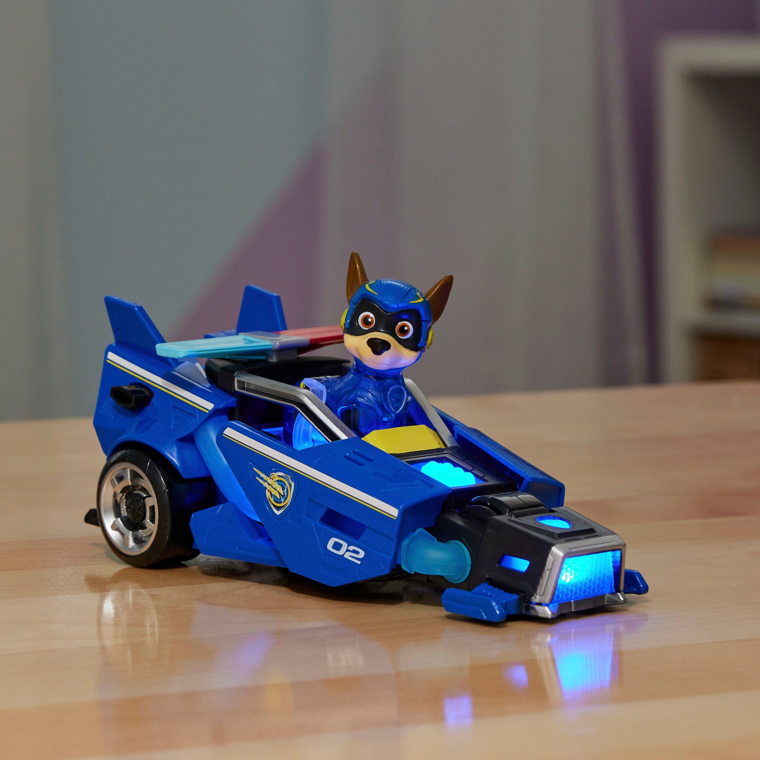 Spin Master Spielzeug-Auto PAW Patrol, Der Mighty Kinofilm: Superhelden-Basis-Fahrzeug von Chase, Polizeiauto mit Welpenfigur, Licht- und Soundeffekt