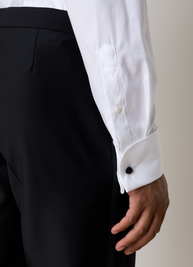 Pantaloni eleganți din lână Denz de la Oscar Jacobson, cu o croială rafinată și opțiune de călcare.