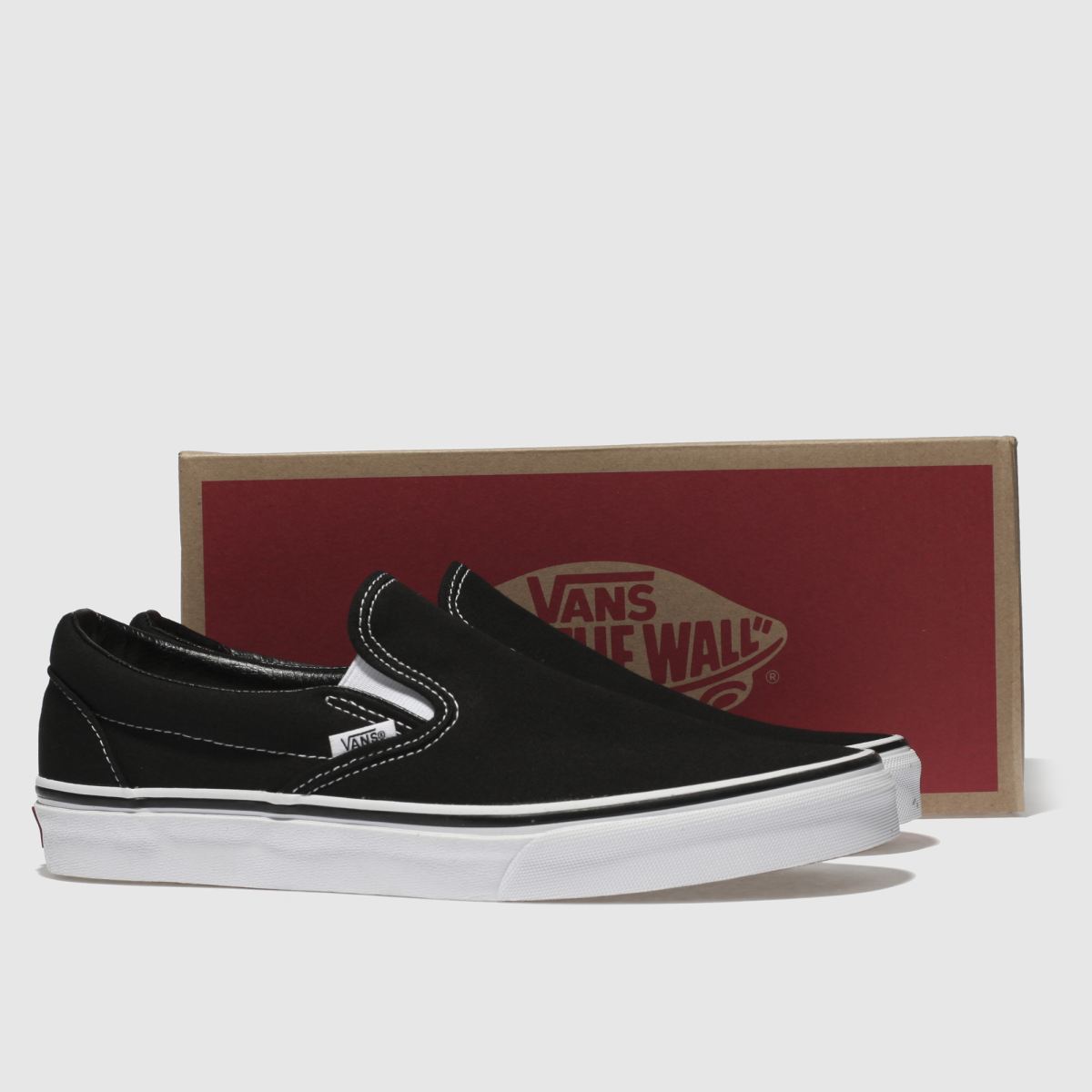 Vans klassiska slip-on-sneakers i svart och vitt