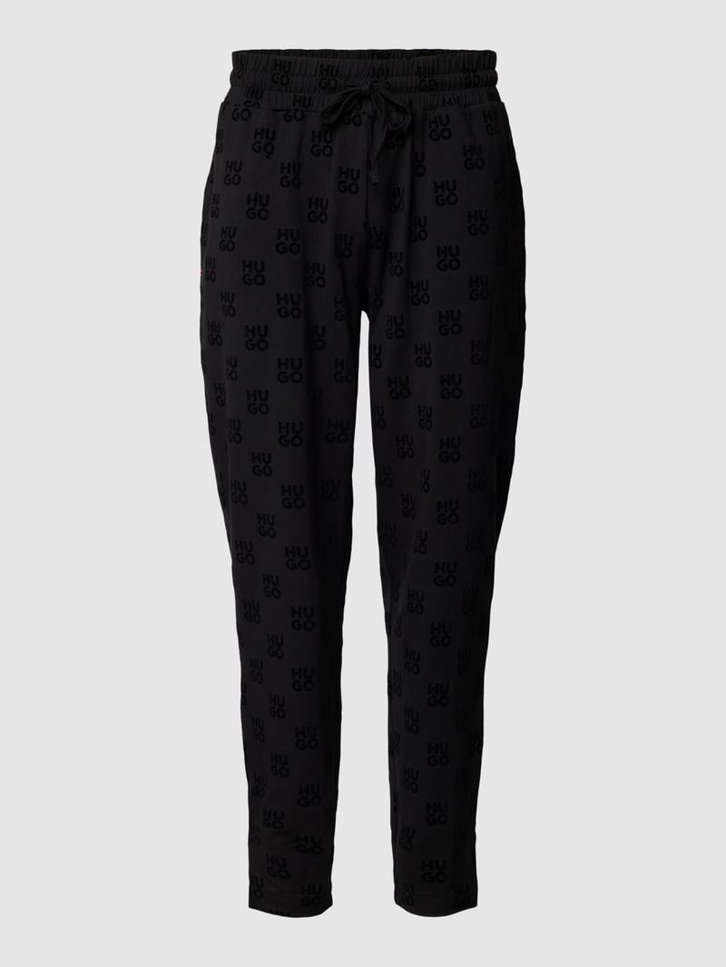 Sweatpants mit Allover-Logo-Muster Modell 'Flock' in schwarz