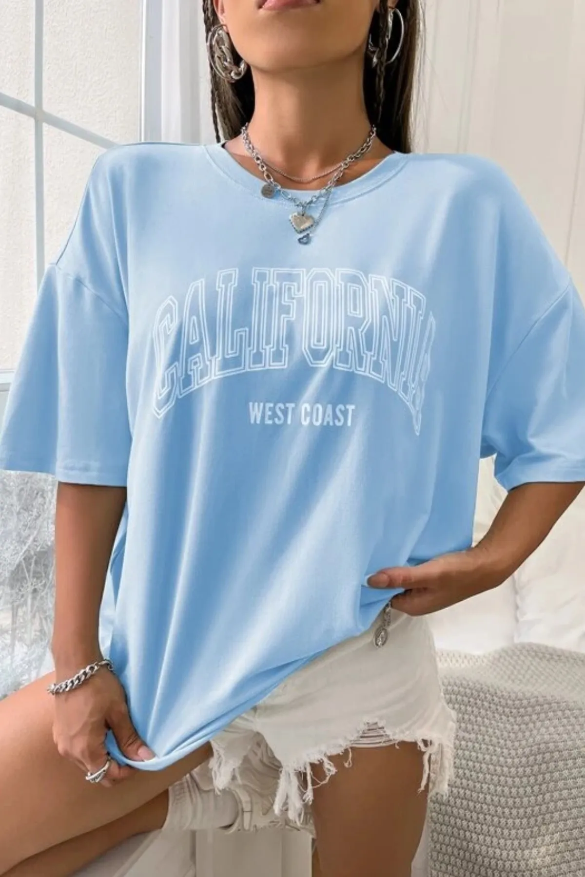 MODAGEN  Unisex-T-Shirt in Babyblau mit Aufdruck „California West Coast“ in Übergröße