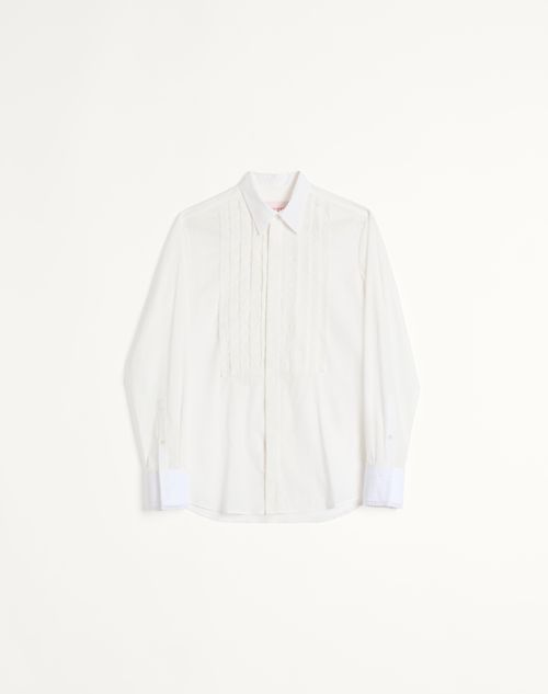 Camisa de musselina de algodão com plastrão e detalhes em renda.