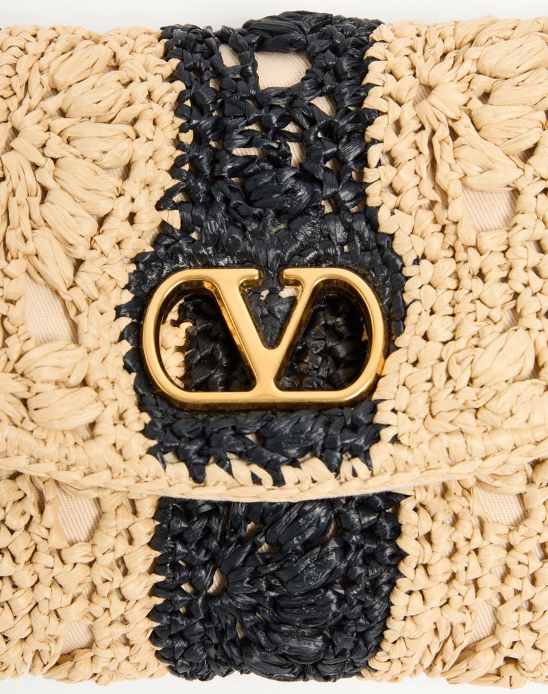 Bolsa de ombro pequena Valentino Garavani Devain em ráfia com motivo de ondas.
