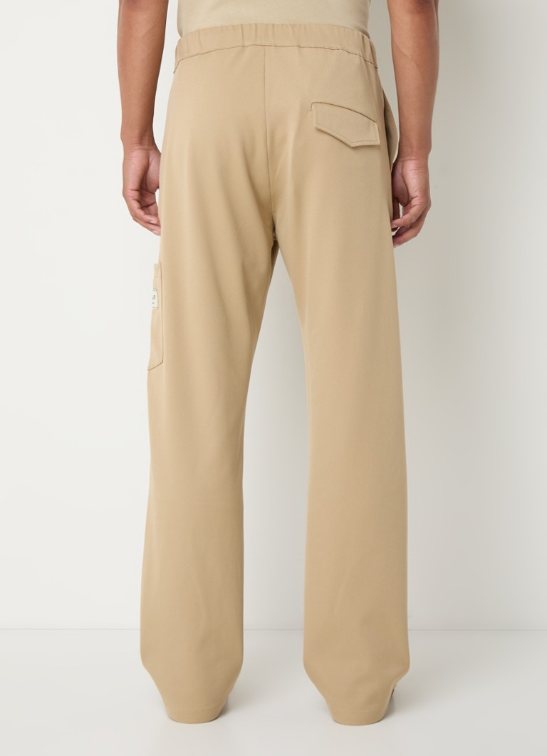 Volné chino kalhoty FLÂNEUR Atelier s prošívanou kapsou