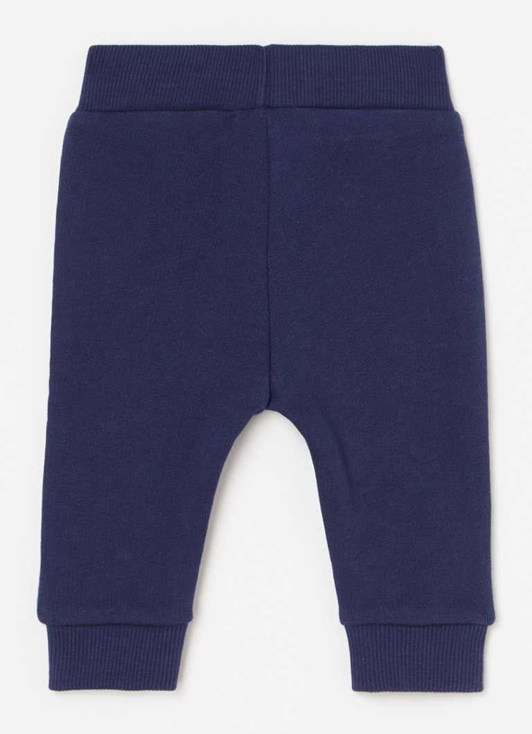 Pantaloni de trening Benetton cu croială conică și broderie.