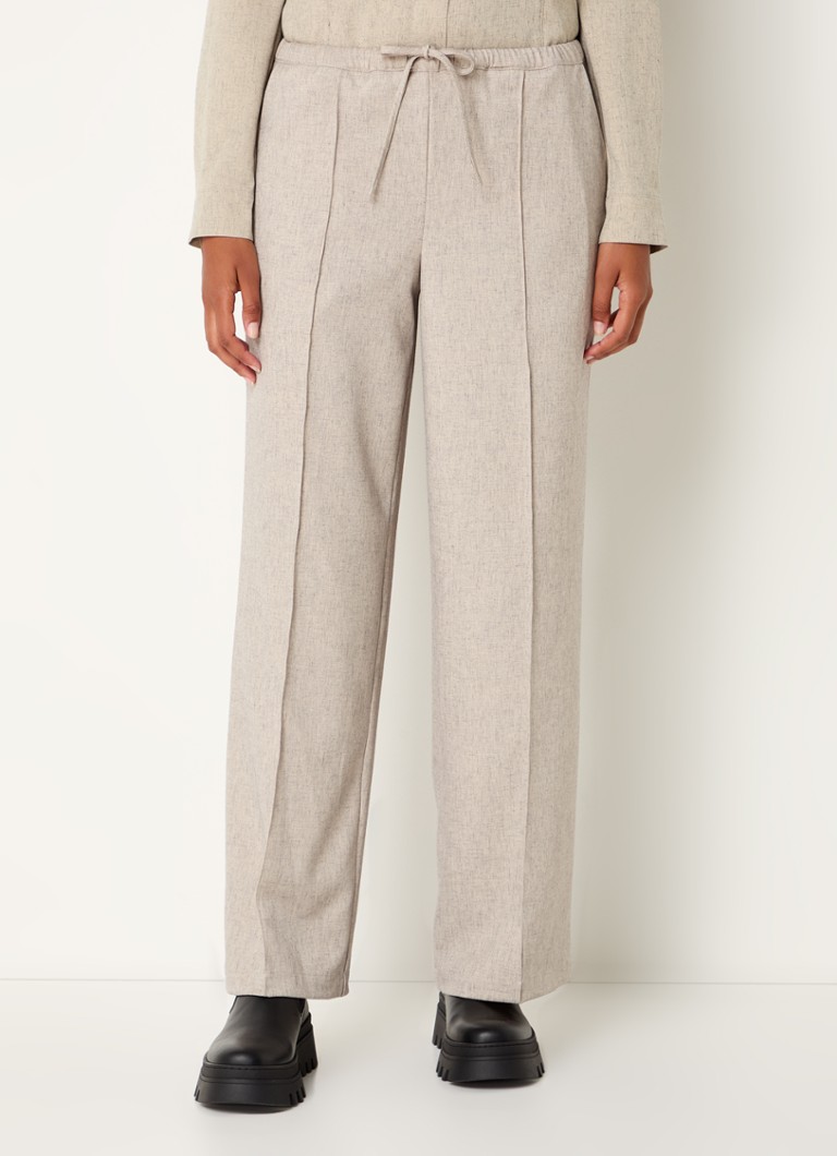 Pantaloni Kalem di Modström a vita media e taglio dritto, realizzati in misto lino con tasche laterali.