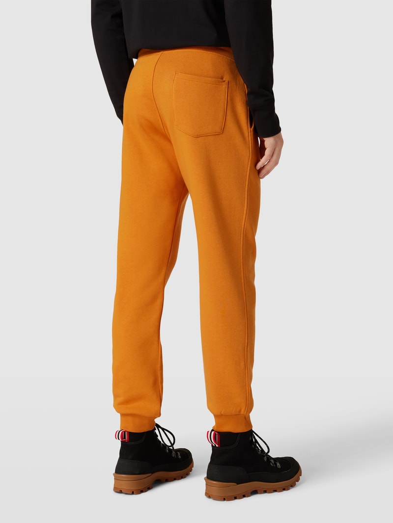 Sweatpants mit Eingrifftaschen in dunkel orange