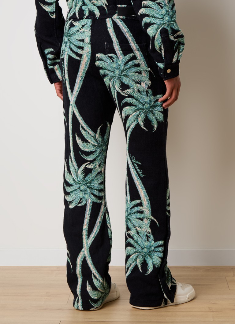 AMIRI Flared trousers with tropical print