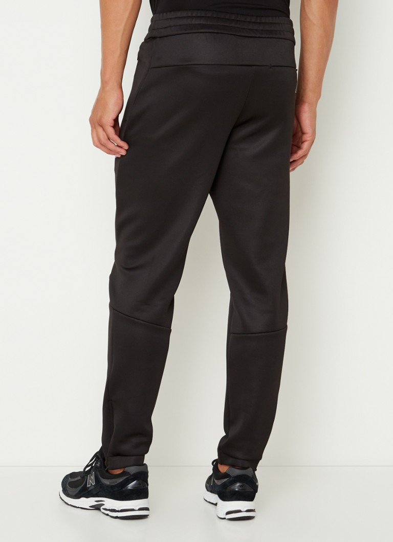 Pantaloni de trening slim fit de la Emporio Armani, cu logo și buzunare cu fermoar.