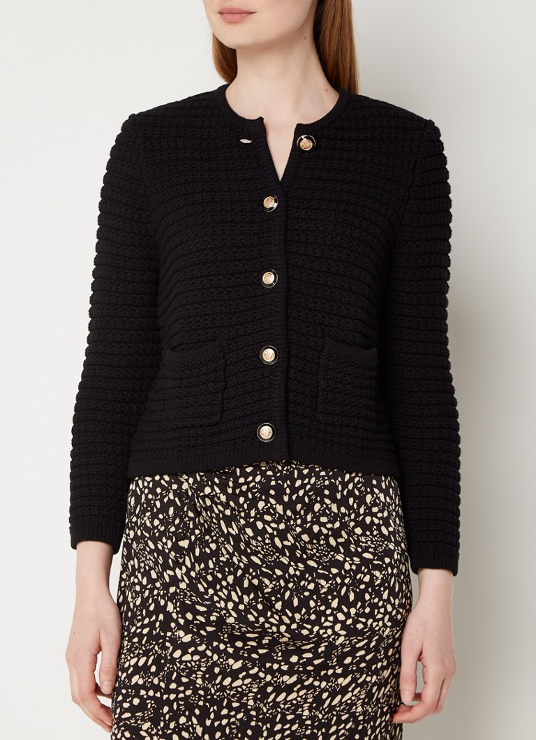 Cardigan Gaspard tricotat gros, croială scurtă și umeri cu burete, disponibil la ba&sh.