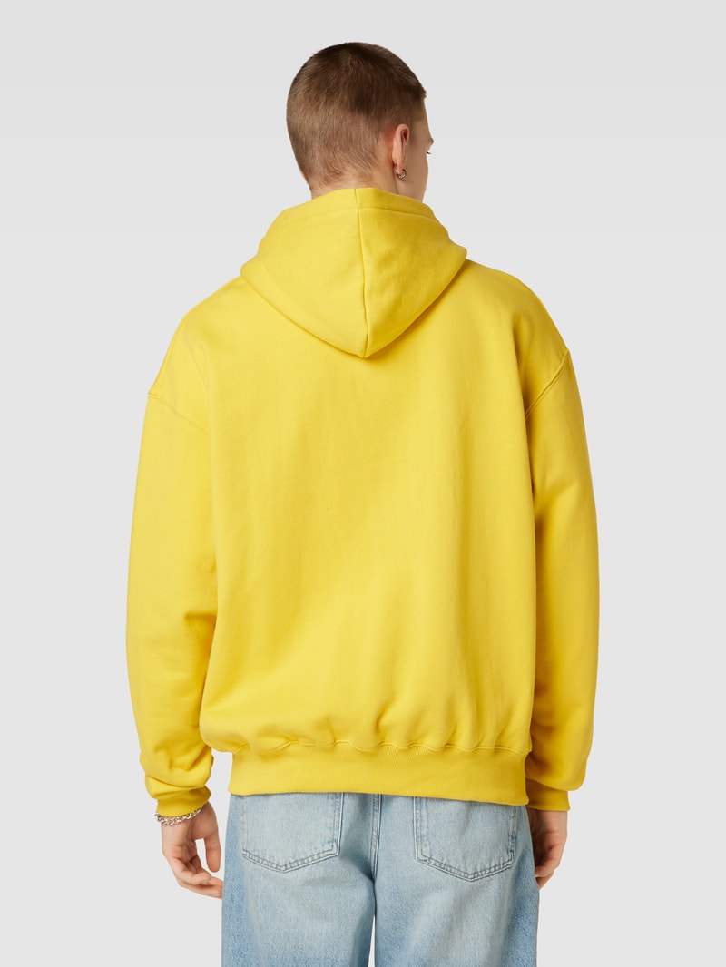 Sweatjacke mit seitlichen Eingrifftaschen in gelb