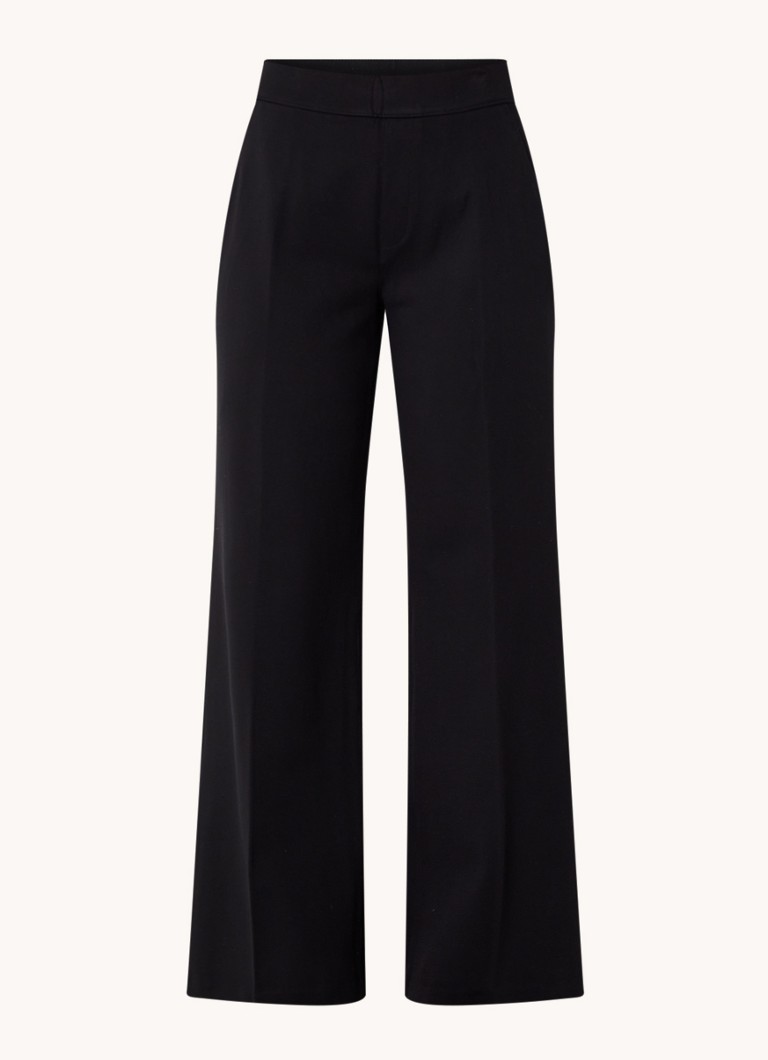 Calças SPANX de cintura alta e corte flare, confeccionadas em malha com costura divisória.