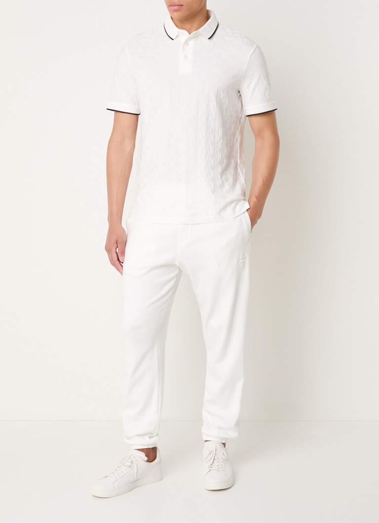 Pantaloni de trening Armani Exchange cu croială conică pe picioare și buzunare laterale.