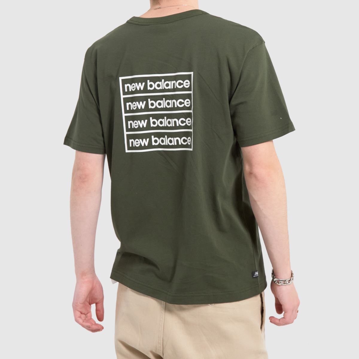 New Balance – Grön vintert-shirt med essentials-motiv