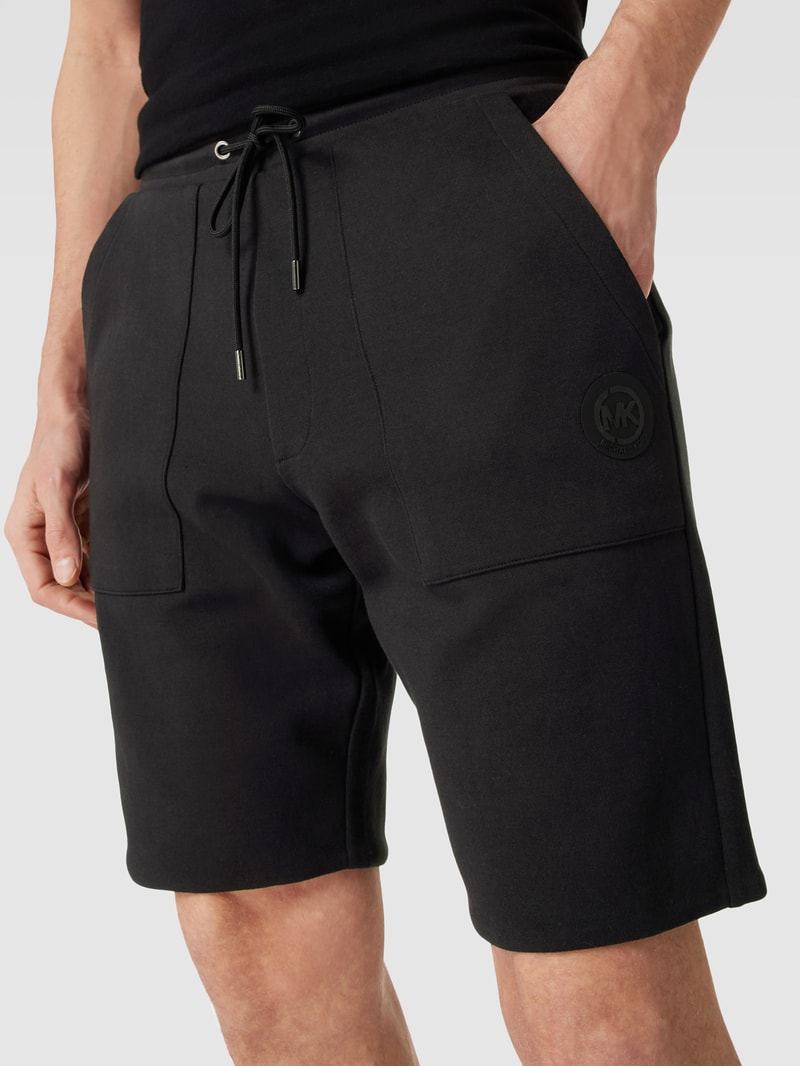 Shorts mit seitlichen Eingrifftaschen Modell 'REVERSIBLE' in schwarz