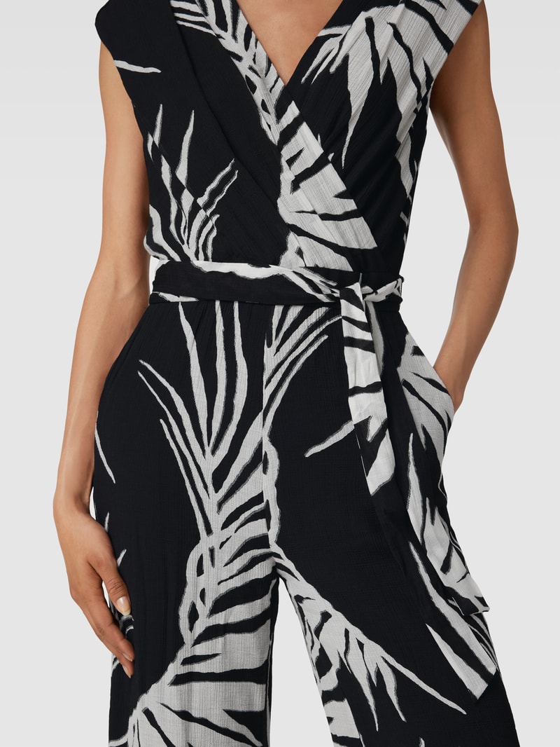 Jumpsuit mit Allover-Muster in Wickel-Optik in schwarz