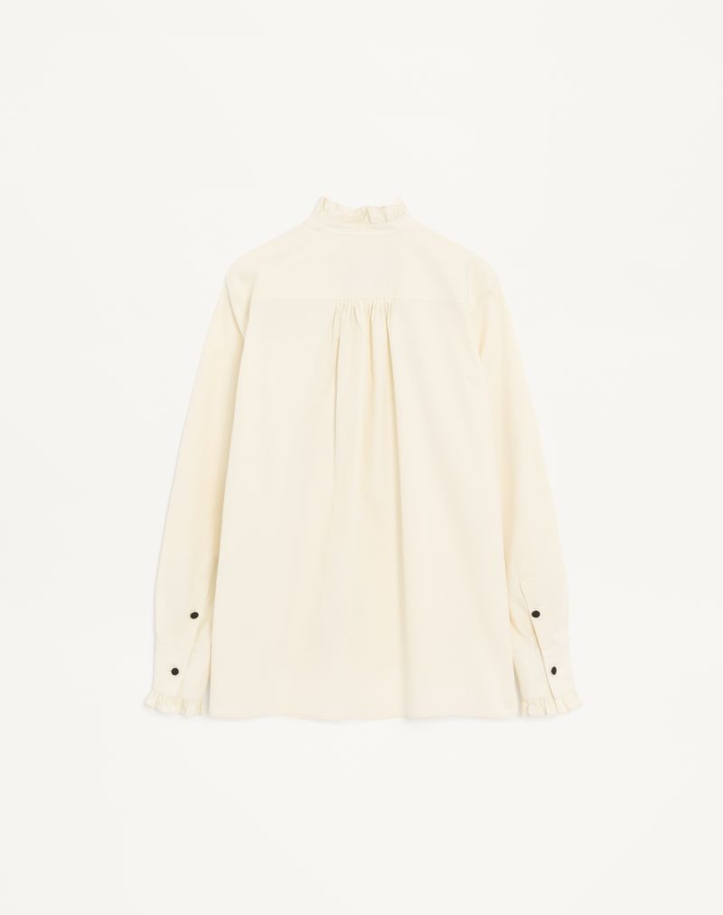 Camisa de algodão popeline com plastrão e babados.