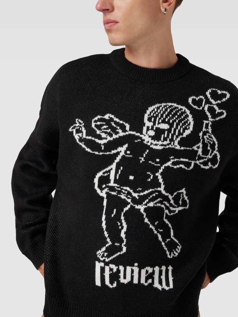 Strickpullover mit überschnittenen Schultern in schwarz