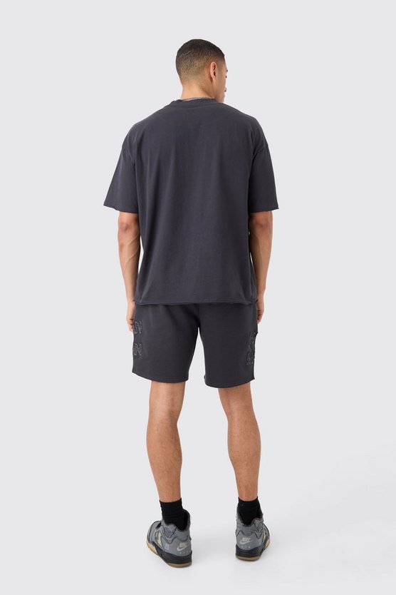 Kastiges zerrissenes Man T-Shirt & Shorts