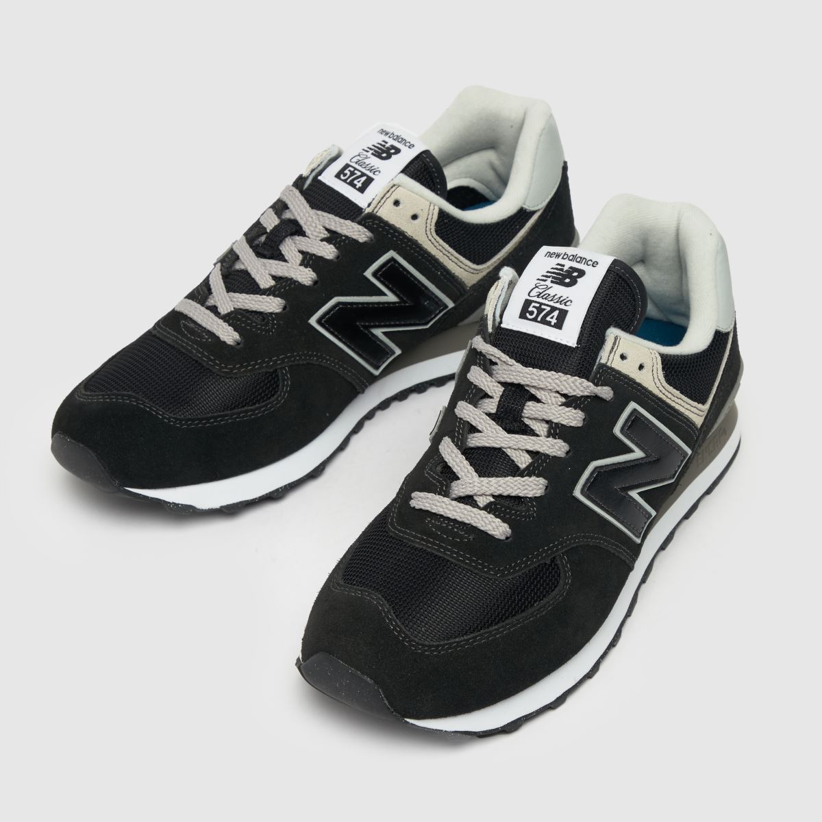 New Balance 574 cipők fekete és fehér színben