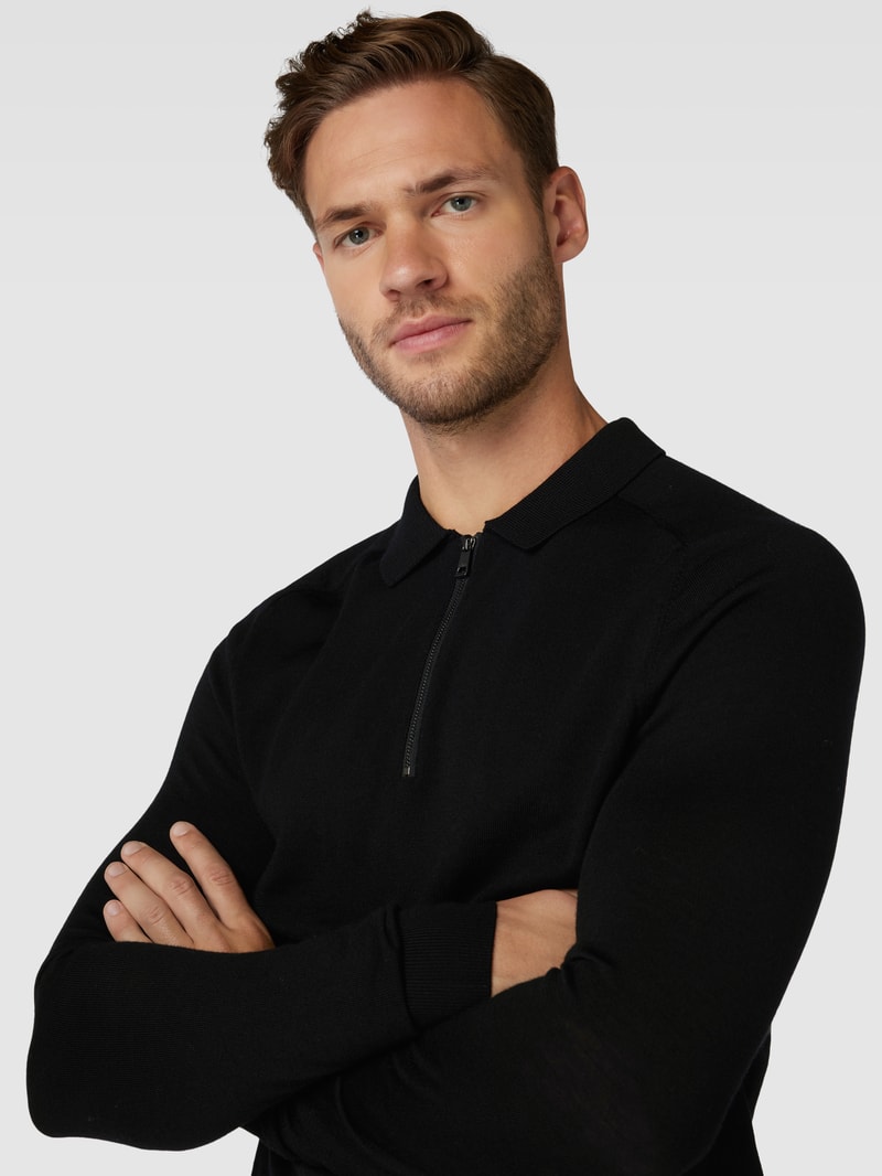 Pullover mit Polokragen aus Schurwolle in schwarz